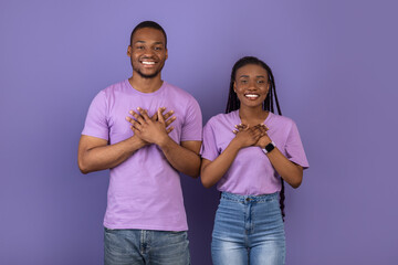 African American man and woman expressing gratitude at studio