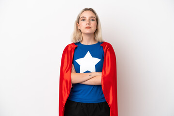 Young caucasian woman isolated on white background in superhero costume with arms crossed © luismolinero