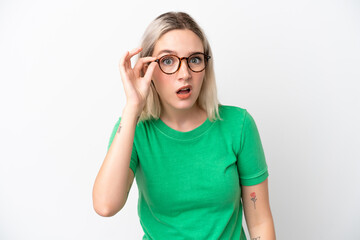 Young caucasian woman isolated on white background With glasses and frustrated expression