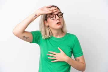 Young caucasian woman isolated on white background With glasses and tired