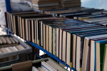 Large assortment of old books at the flea market. Yellowed volumes of poetry
outdoors
clearance...