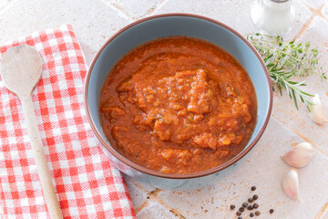 top view of a Bowl with tasty tomato sauce on a table