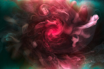 Fototapeta premium Green pink smoke on black ink background, colorful fog, abstract swirling touch ocean sea, acrylic paint pigment underwater