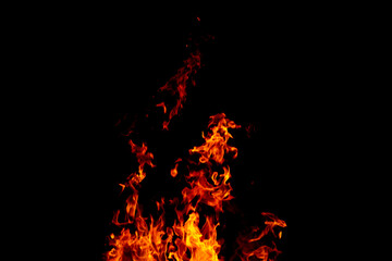 Bright fiery symbol on a black background. Fire background. Fire flame on a black background