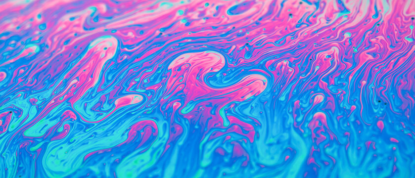 Fluid soap bubble psychedelic colorful abstract art background.