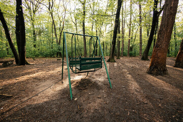Green swing in the woods