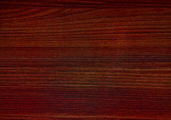 abstract wood texture. surface of teak wood background in dark red color for design and decoration. wooden laminated for interior furnishing work. artificial wood use as background.