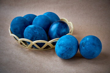 Blue painted eggs on a paper background
