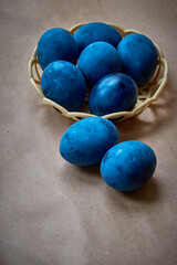 Blue painted eggs on a paper background