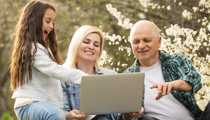 Generation Family On Grass Together in the garden