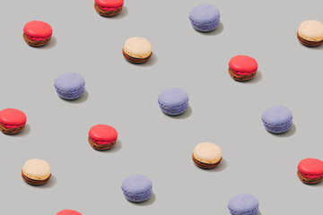 Pastel grey table top with colorful macarons pattern. The concept of minimal sweet food. Cookie concept