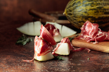 Juicy melon with prosciutto and rosemary.
