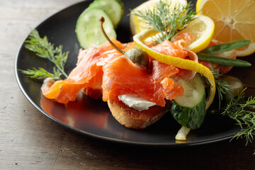 Sandwich with salmon and greens.