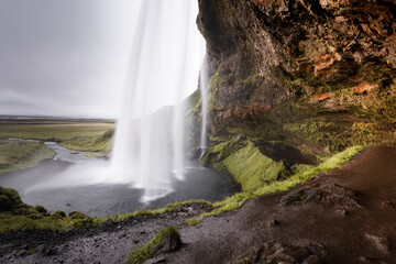 Fototapeta na wymiar Waterfall over a cliff - Seljalandsfoss