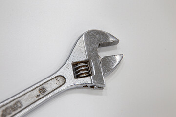 Close-Up Of Wrench Against White Background