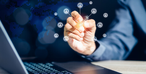 Businessman is pointing virtual screen icons on Laptop Computer, digital marketing, financial, banking and big data