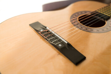 Obraz premium A part of brown wooden classic guitar. Six strings