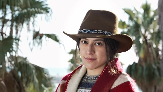 Portrait of Native American Woman with cowboy hat. Young Mixed Race Hispanic Female