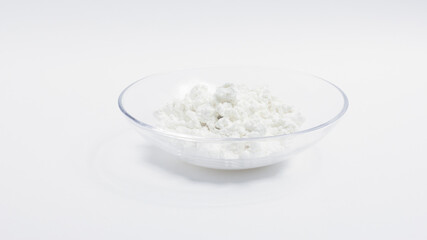 cottage cheese in a glass transparent bowl isolated on a white background