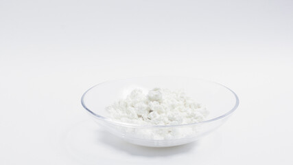 cottage cheese in a glass transparent bowl isolated on a white background