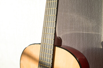 Obraz premium A part of brown wooden classic guitar. Six strings