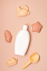 Kids summer accesories and sun screen bottle for sunny days and vacations. Sand molds and sun cream for fun at the beach