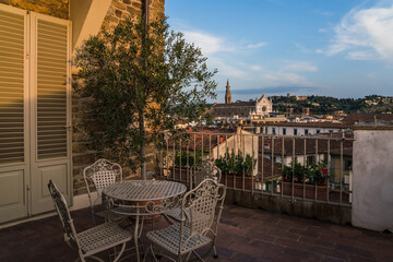 rooftop terrace with view of Florence, Italy and church of Santa Croce 