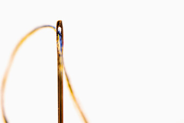 Yellow and blue threads in the needle as a symbol of the struggle of the Ukrainian people against russian aggression for freedom and democracy.