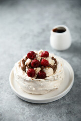 Homemade Pavlova dessert with raspberry and chocolate