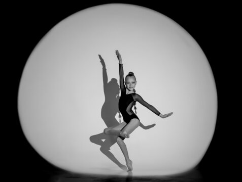 black and white photo of a gymnast ballet dancer
