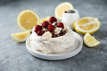 Homemade Pavlova dessert with raspberry and chocolate