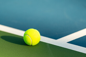 Yellow tennis ball at tennis court