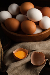 Chicken eggs in a wooden plate