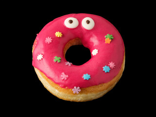 Donut with red icing and confetti with eyes