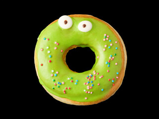 Donut with green icing and confetti with eyes