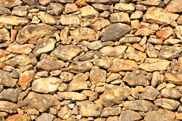 Old yellow brown masonry wall of stones