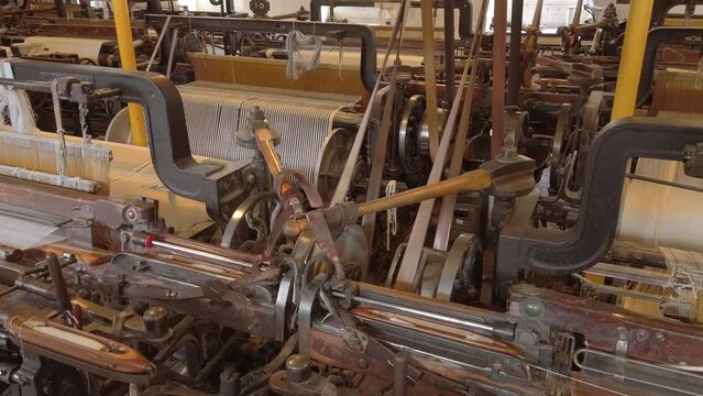 A working textile mill.  the belts used to power the looms