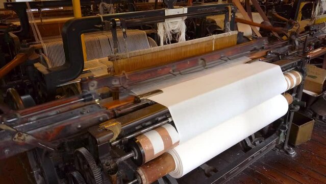 A cotton loom at a working textile mill, with audio. Powered by a water wheel.