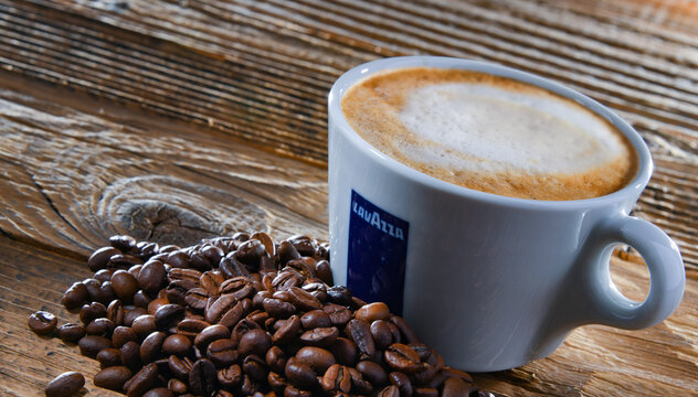 Cup of Lavazza coffee on a wooden table