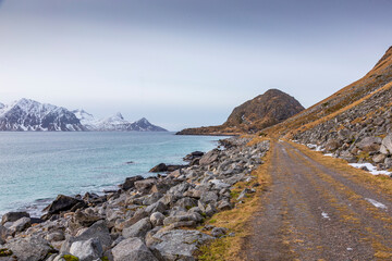 Fototapeta na wymiar Old gravel road at Uttakleiv in Lofoten Islands. Norway.