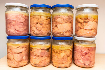 There are jars of chicken stew on the shelf. Home-made eco-friendly products