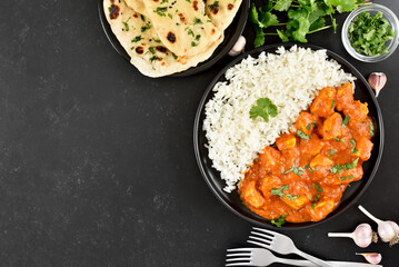 Indian chicken curry with rice on plate - obrazy, fototapety, plakaty