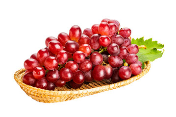 Bunch of ripe red grapes, Crimson Seedless Grapes,  with green leaf in bamboo tray isolated on white background with clipping path.