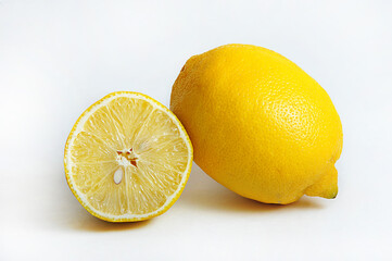 whole lemon and half a lemon on  white background