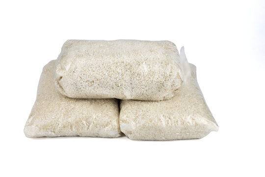 Three plastic rice packages on a white background, isolated