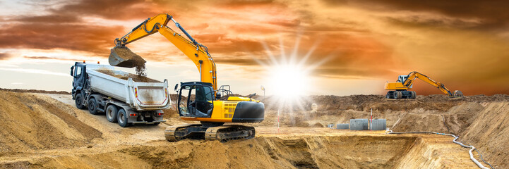 Fototapeta excavator is digging on construction site obraz