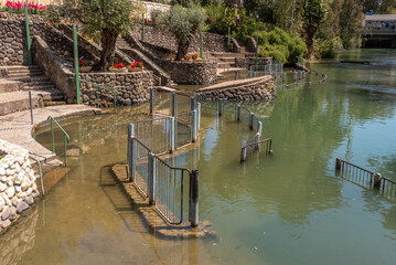 Fototapeta na wymiar The baptismal area of the Yardenit Baptismal site on the Jordan River in Israel 