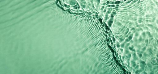 fresh water wave surface texture on green background with copy space. hydration and moisturizer. banner