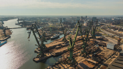 A view of the Gdańsk Shipyard and cranes in the morning. An amazing sight that will take your breath away from the industral breathtaking view.