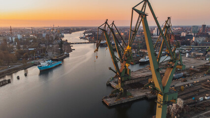 A view of the Gdańsk Shipyard and cranes in the morning. An amazing sight that will take your breath away from the industral breathtaking view.